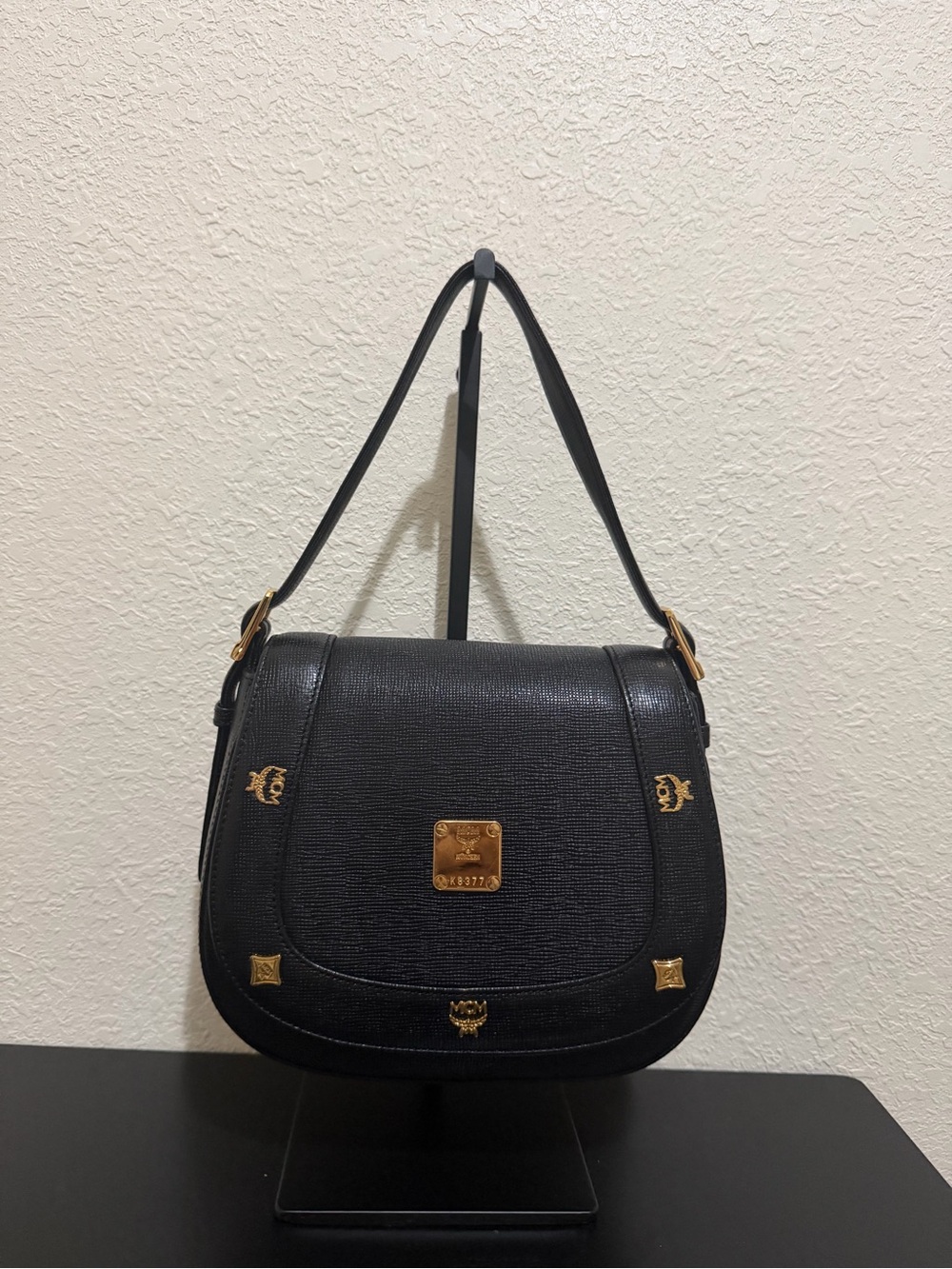 MCM Black Leather Saddle Shoulder Bag with Gold Accents